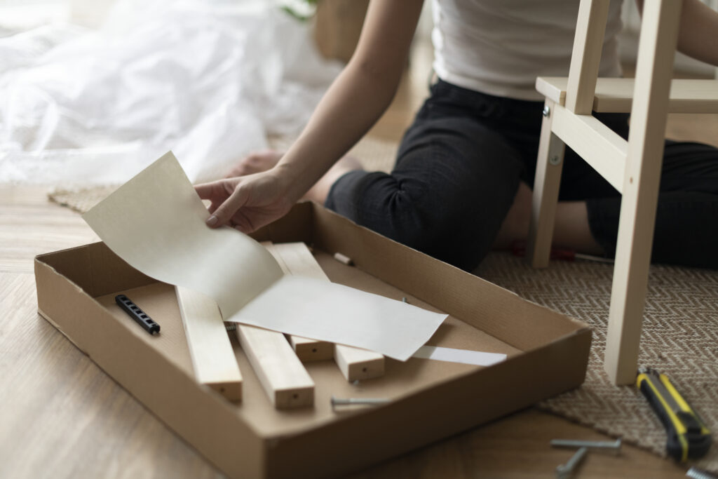 Woman assembling a diy chair from scratch